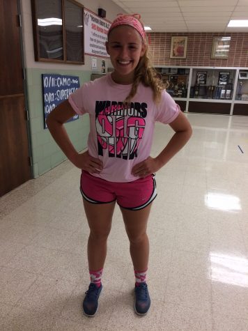 Senior Casey Kummer is showing her support by wearing the Dig pink shirt