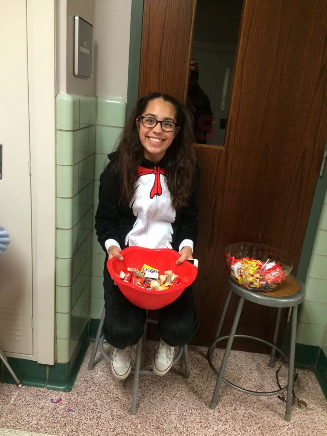 Junior Amaya Rutzel dresses up as the Cat in the Hat for the kids. Photo by Emily Christian