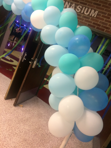 Balloons were set up in the entryway as students walked into the gym. Later in the evening, some of the balloons were thrown out onto the dance floor.