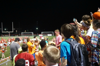 Milk chugging occurred during the Friday night football game. 