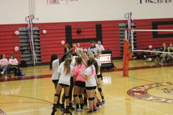 Varsity Volleyball Wins Dig Pink Game