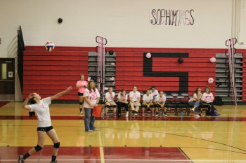 Allie Grothey spiking the ball.