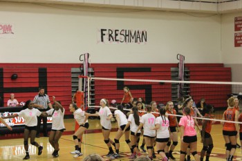 Varsity volleyball getting excited for the match!