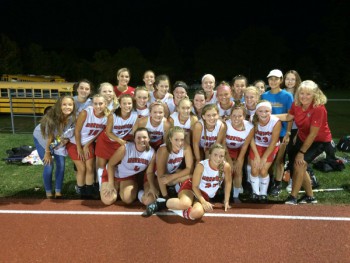 The girls are all smiles after winning the district title! Photo from Warrior Fieldhockey Twitter