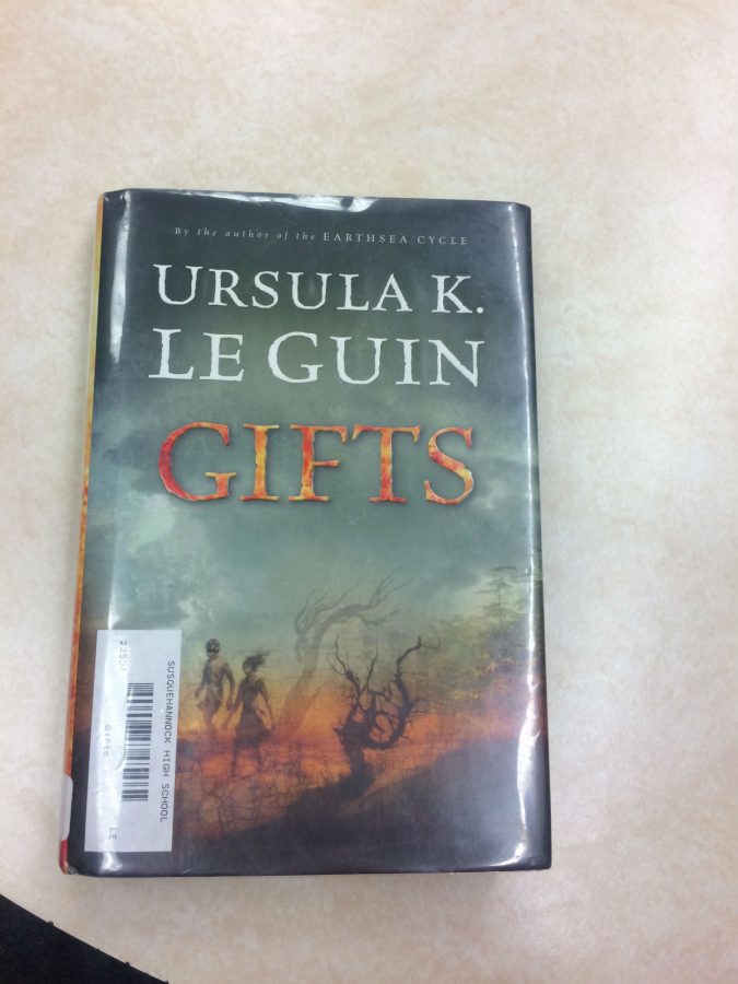 Gifts  by Ursulak Le Guin was located three books down from To Kill a Mockingbird. The clue inside said, Our killer teaches at Susquehannock High, you know you can run but how well can you hide? I would hurry if I were you, you never know the killer could be right behind you. To identify the weapon found on the floor, go to the poet who died in Baltimore.