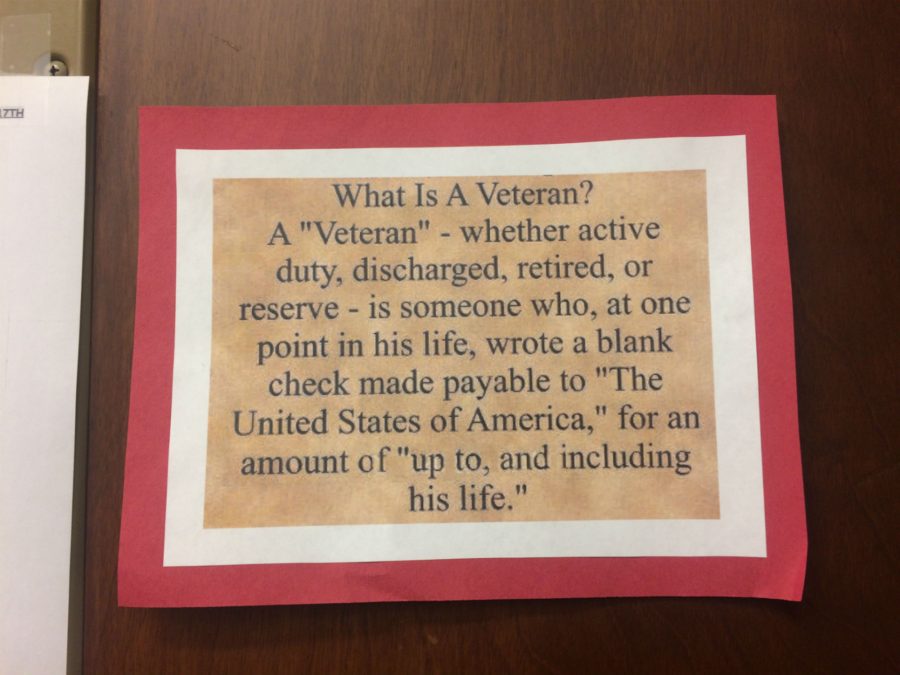 The library honored veterans by putting up a poster that defined what a veteran is.