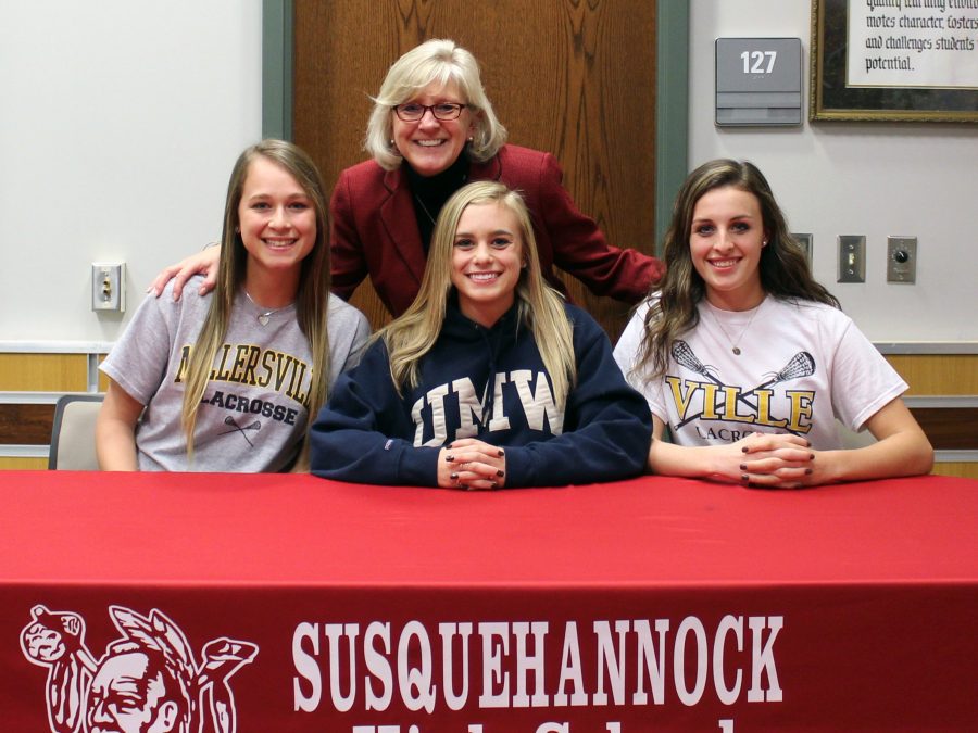 Dr.+Lemmon+with+Gena+Speights%2C+Rachel+Marshner%2C+and+Kayla+Held+on+signing+day.