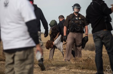An activist getting arrested during the protests in South Dakota.