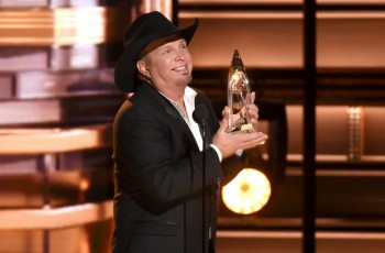 Garth Brooks with his Country Music Award. (Photo by Charles Sykes/Invision/AP)