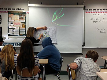 Students went to several career panels where they listened to multiple adults talk about their careers and how they have gotten where they are now. In this picture, a civil engineer is showing  a kind of map that she works with very frequently. 