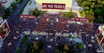 A screenshot from "We The People" music video. 