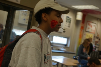 Freshman Cameron Clarke stands with his carnation. 