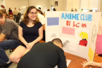 Anime Club president Erica DAmore gets students to sign up.