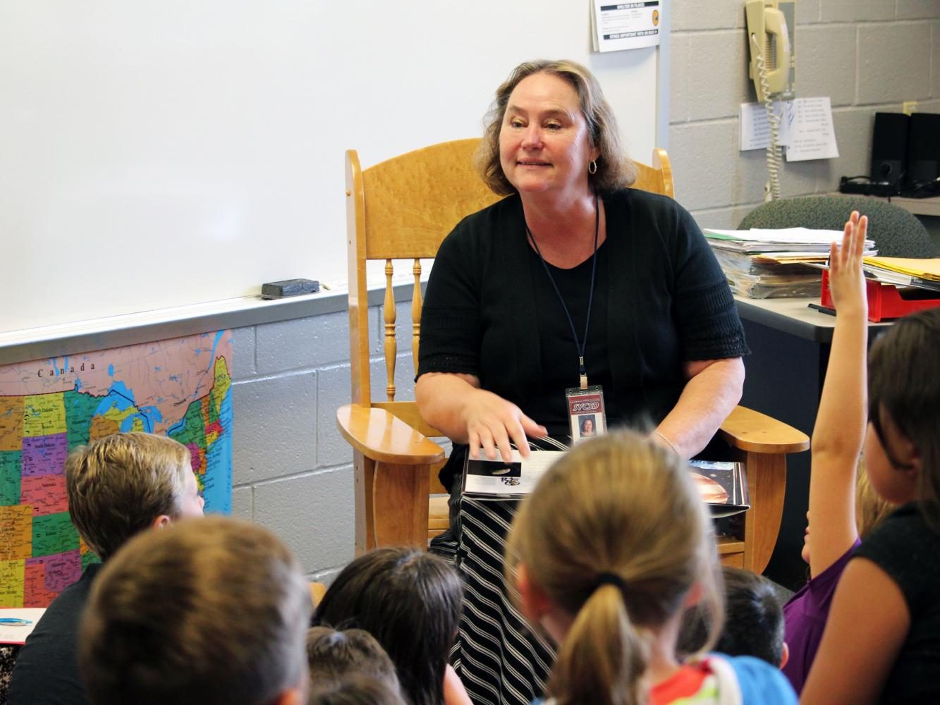Marianne Swade reads to her 4th grade students at Southern Elementary School.