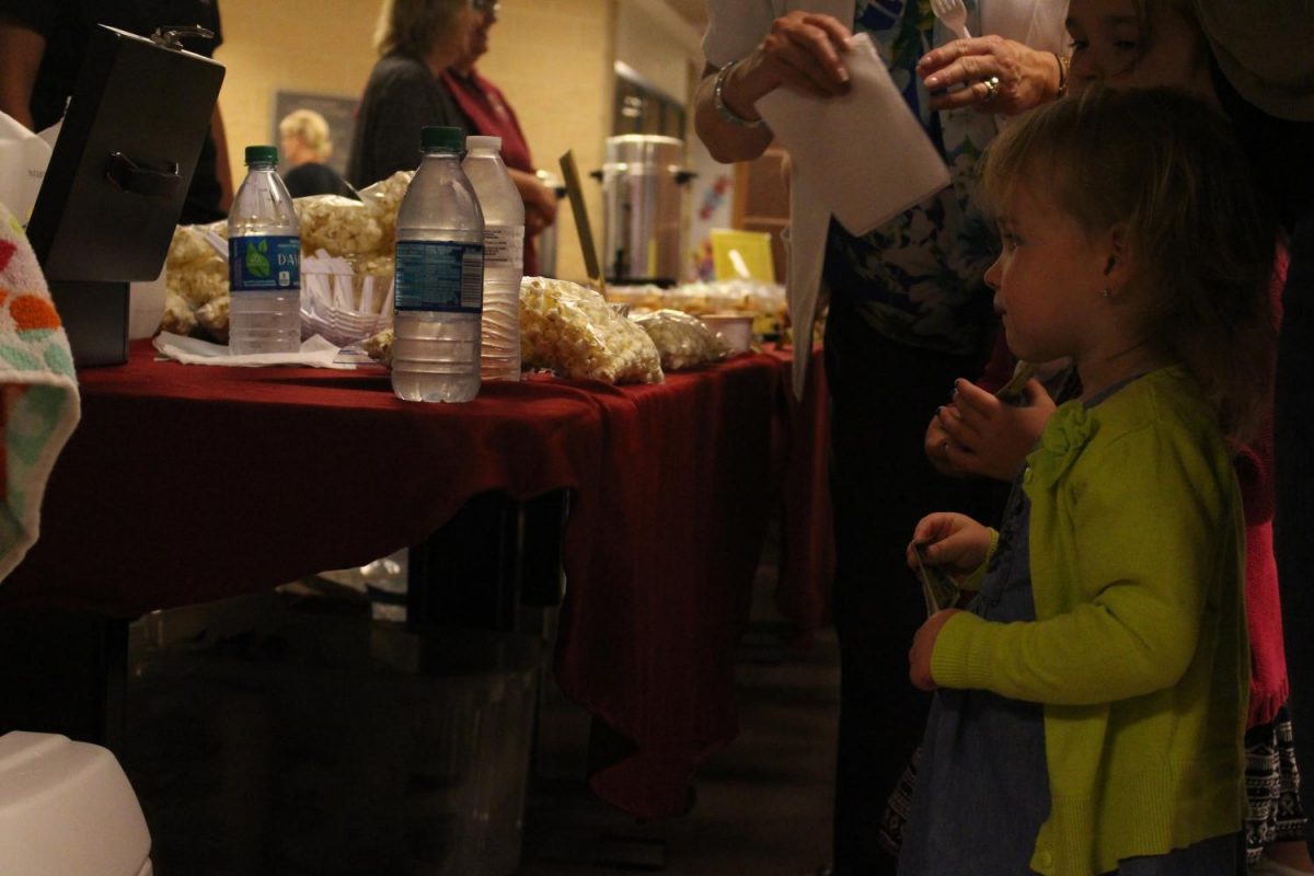 During the Intermission, audience members purchased baked treats at the concession tables. Photo By: Lizzy Beall