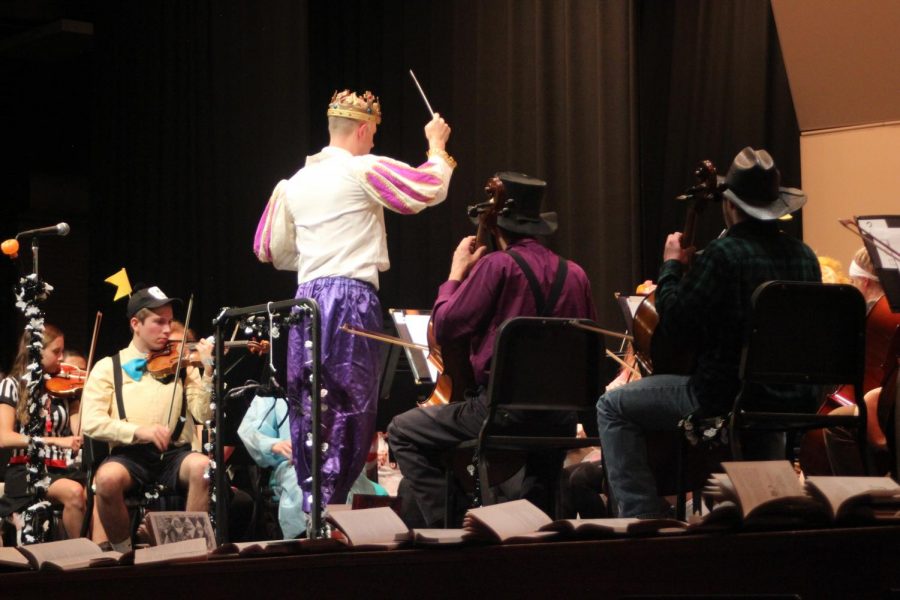Zachary Levi conducts the high school orchestra. Photo by: Brittany Boone