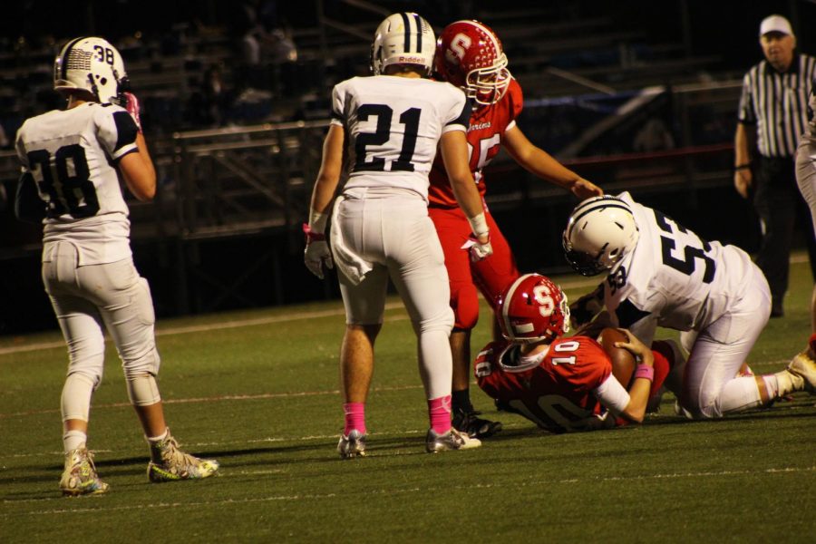 Senior Hunter Sentz is tackled for the ball by a player from West York. 