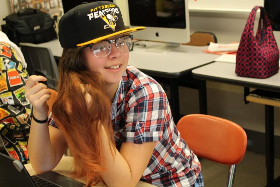 Senior Jade Reall talks to a classmate in her digital media class. Photo by Christopher Norris.