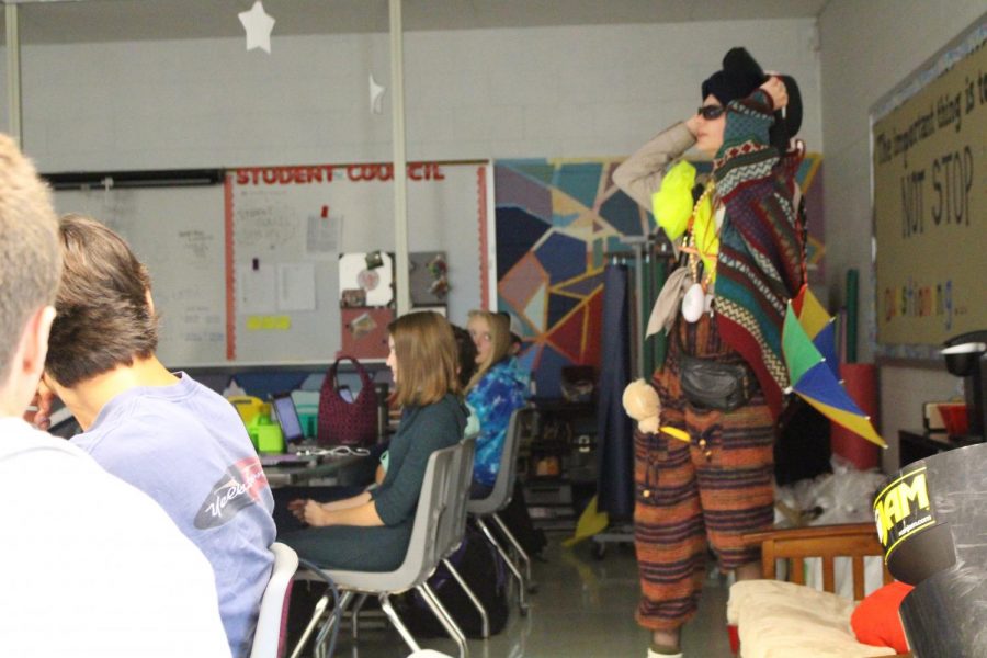 Senior Kaleb Fair shows off his wardrobe disaster to a marketing class. Photo by Christopher Norris 