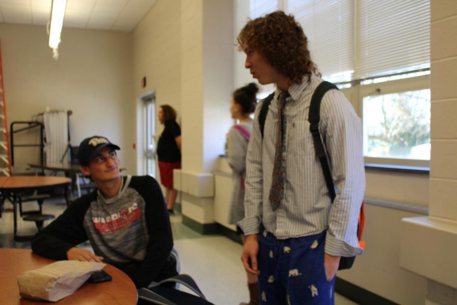 [From left to right] Senior Josh Smiley and Junior Gregory Dwyer socialize in the cafeteria. Photo by Christopher Norris