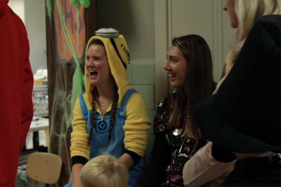 Seniors Riley Roeder and Maddie Stone dress up as a minion and a nurse. [Photo by Maggie Sisler] 