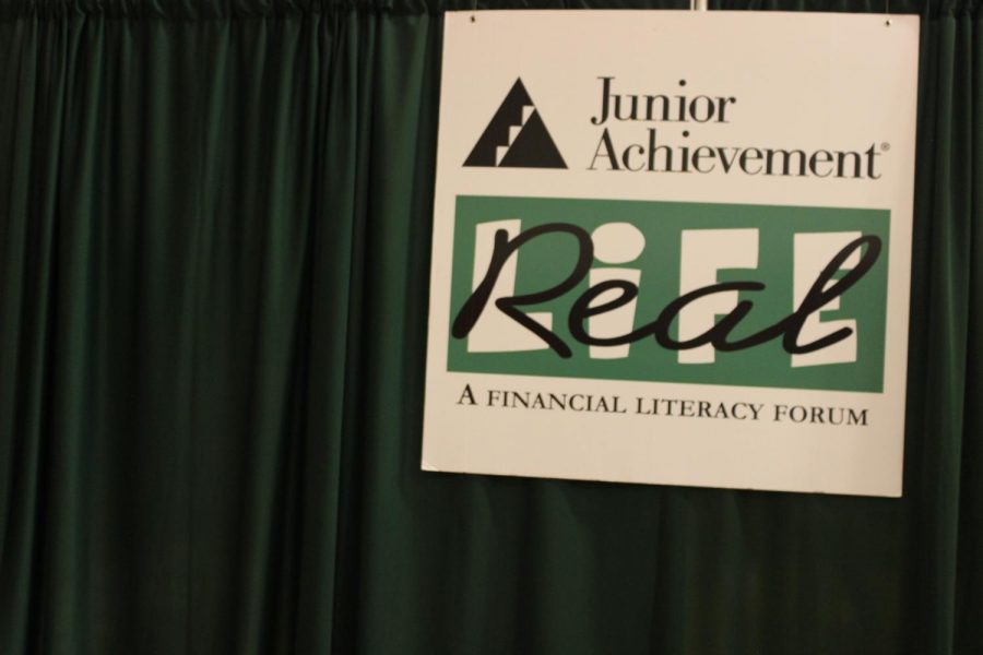 Seniors prepare for Real Life. Organizer Melissa Bell talked about how she came across the program.  Each year when I meet with the Junior Achievement reps, they share whats new, and last year they talked about the financial literacy summit, said Bell.