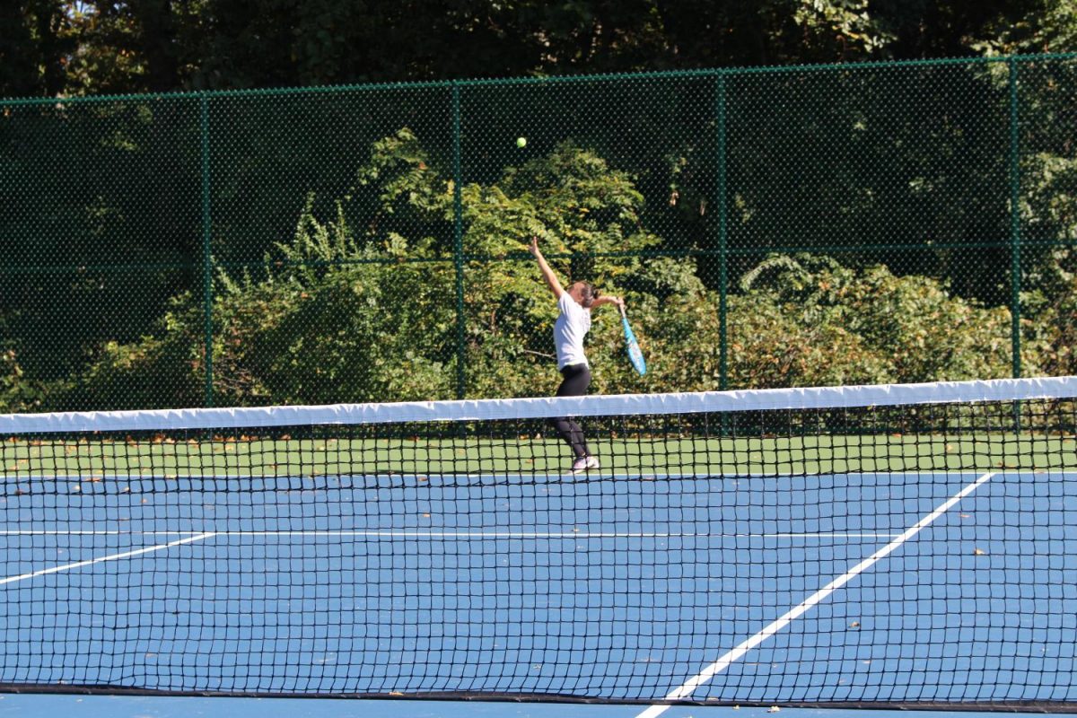 Kaitlyn Endres practices on her tennis serve