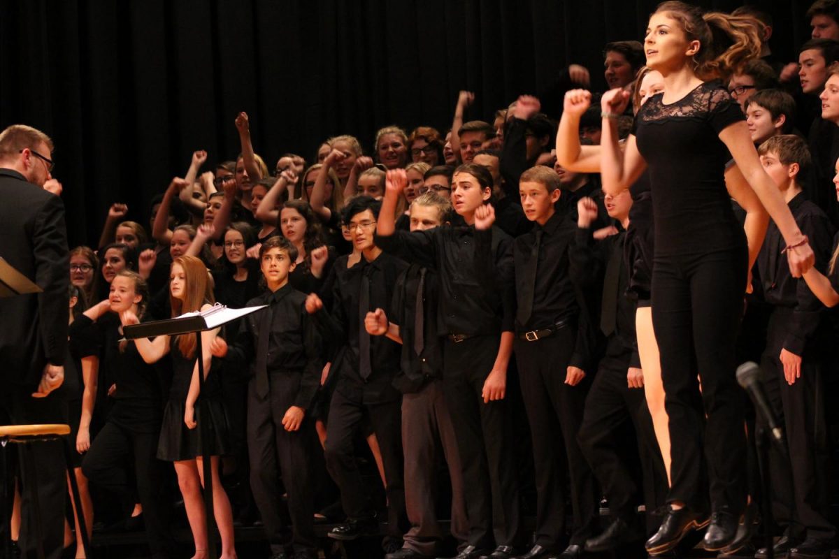 Choir member Stephanie Graffins steps leave the stage in A Step in Time. Photo By: Lizzy Beall