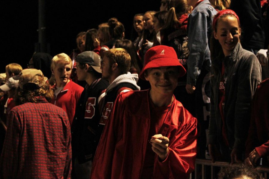 Senior Kaleb Fair poses for the camera in the student section. 