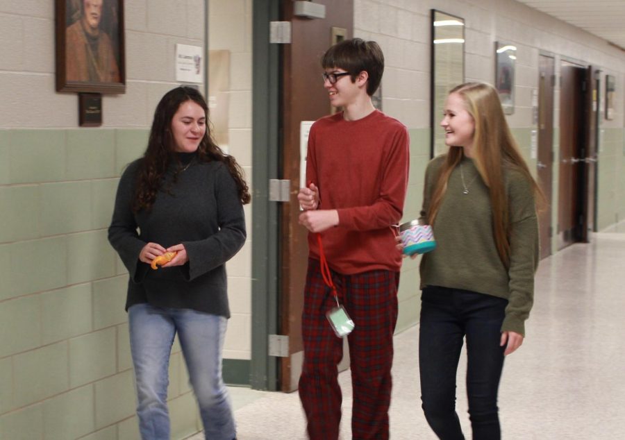Junior Thomas Hoops talks with his friends, juniors Meghan Adams and Julianne Cassady, on pajama day.
