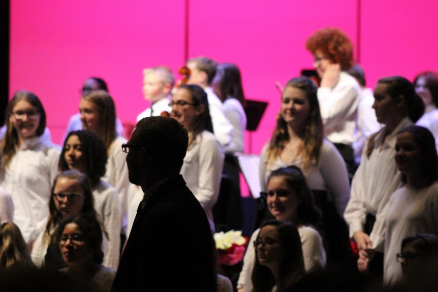 Jay Althouse, choral conductor,  gives recognition  to the MS choir as the concert closes. 