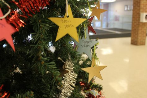 The giving tree stands in the auditorium lobby with