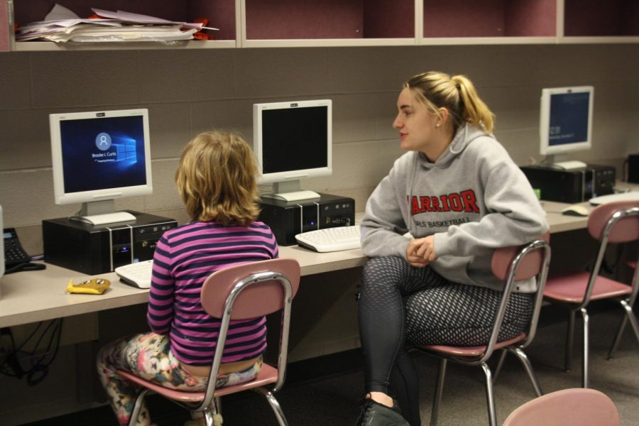 Senior, Anna Mahan meets with her little buddy in the computer lab.
