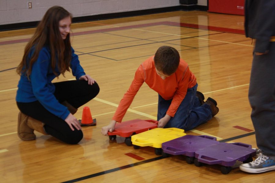 The buddies work together to come up with fun games to play in the gym.
