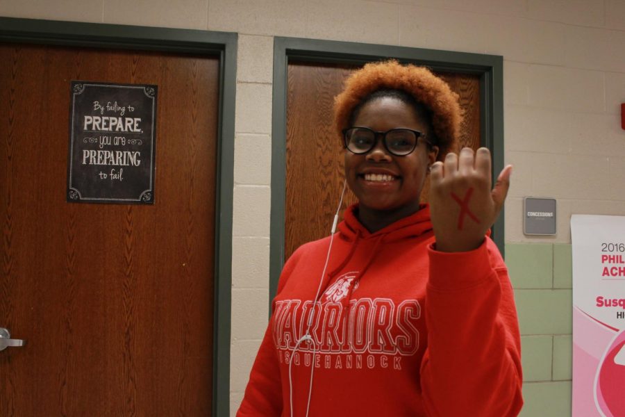  Freedom fighters in this movement have the goal of bringing an awareness that leads to action around the globe. Freshman Erica Taylor holds up the symbol to end slavery. 
