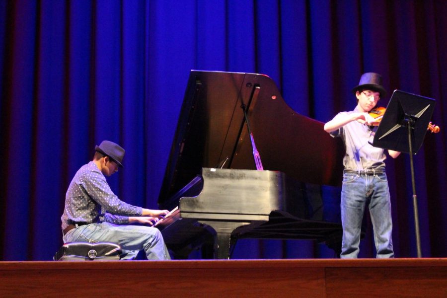Sophomores Rohit Kandala and Coleman Bongardt perform the opening act of the talent show. [Photo by Maggie Sisler]