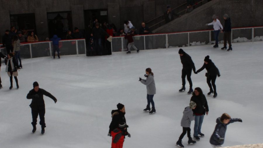 People go ice skating on the ice rink everyday in the winter. The ice rink is very popular during the holidays.
