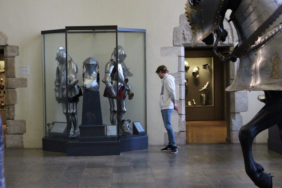 Senior Hunter Davis breaks off from the rest of the group to examine a suit of armor. 