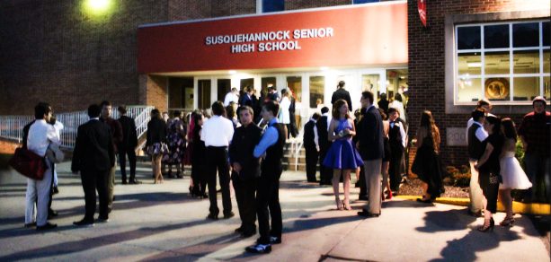 Students wait outside for the doors to open and for the fun night to begin. Some get pictures from the York Daily Record. 