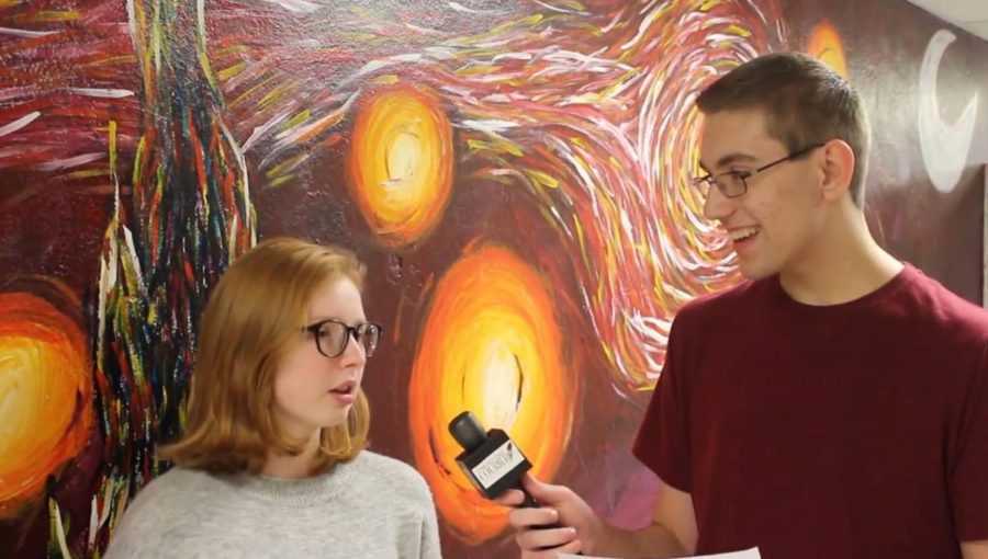 AJ Marusko gets interviewed about her winning mural design. Photo by Michael Daiuto. 