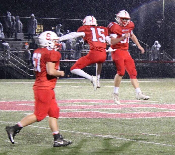 Junior Connor Kernan(15) and Daniel Clapp(31) celebrate after time expires in the fourth quarter. Photo courtesy by Alex Martuszewski