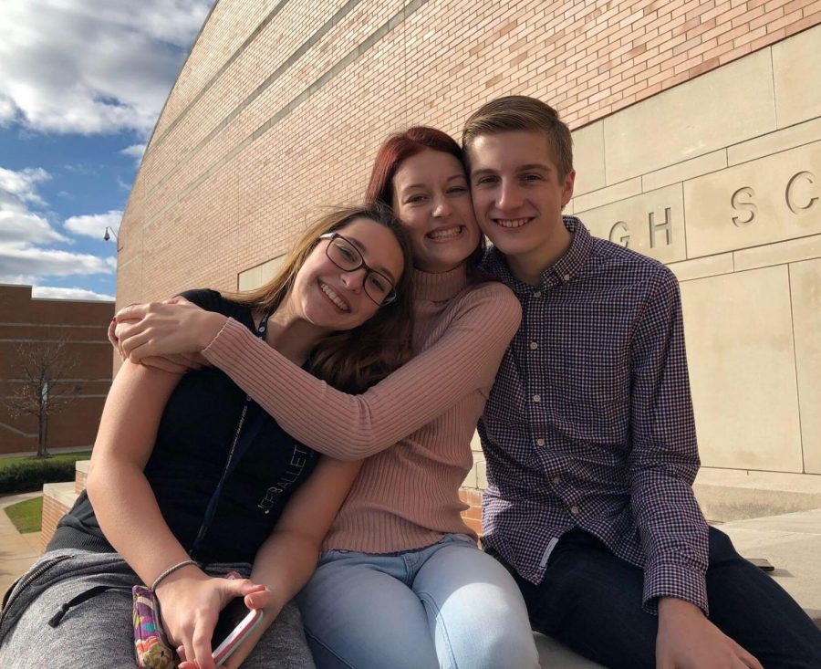 (From left to right) Junior Bailey Ryon and seniors Cora Dunaja and Shane Waston smile as the troupe arrives at North Penn high school.
