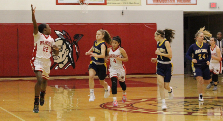 Walker signals to another player to toss her the ball. Walker has been playing basketball for the past seven years.  She is averaging more than 10 points-per-game for her high school career.