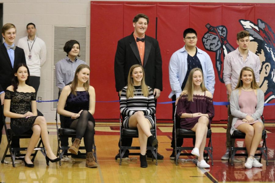 Pairs wait to see who will get crowned. From top row left to right, bottom row left to right: senior Shane Watson, senior Jasper Rowe, senior Dan Poole, junior Garrian Phanhthy, junior Cody McCredie, senior Cora Dunaja, senior Raili Sormus, junior Hannah Adler, junior Maddy Yoakum, and junior Sarah Ketterman. The Snow King competition is hosted by the Mini-THON club at Susquehannock. Boys from the senior and juniors classes, compete to see who can raise the most money or collect the most canned goods. Each boy places a large decorated cardboard box in the auditorium lobby and anyone from the student body can donate to who they wish. These boys also gather monetary donations that will go towards Mini-THON. Photo by Alex Martuszewski. 