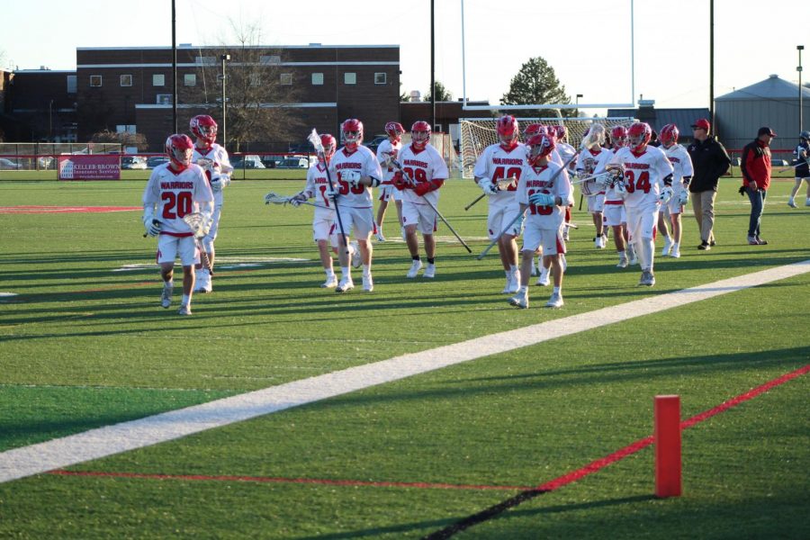 The Warrior boys lacrosse team runs to the end field after the first half is over. The Warriors led over the Dallastown Wildcats 4-1. Junior Gavin Held has strong thoughts on this season. “Our team has one goal and that’s to win some type of championship,” said Held. “I think with the leaders on this team and our coaching staff, that goal is feasible.”
Photograph by Mackenzie Womack