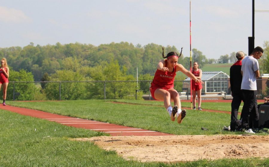 Freshman Shelby Derkosh competes in the long jump. Derkosh took first place in the long jump, triple jump and 400m race in the Kennard-Dale meet.