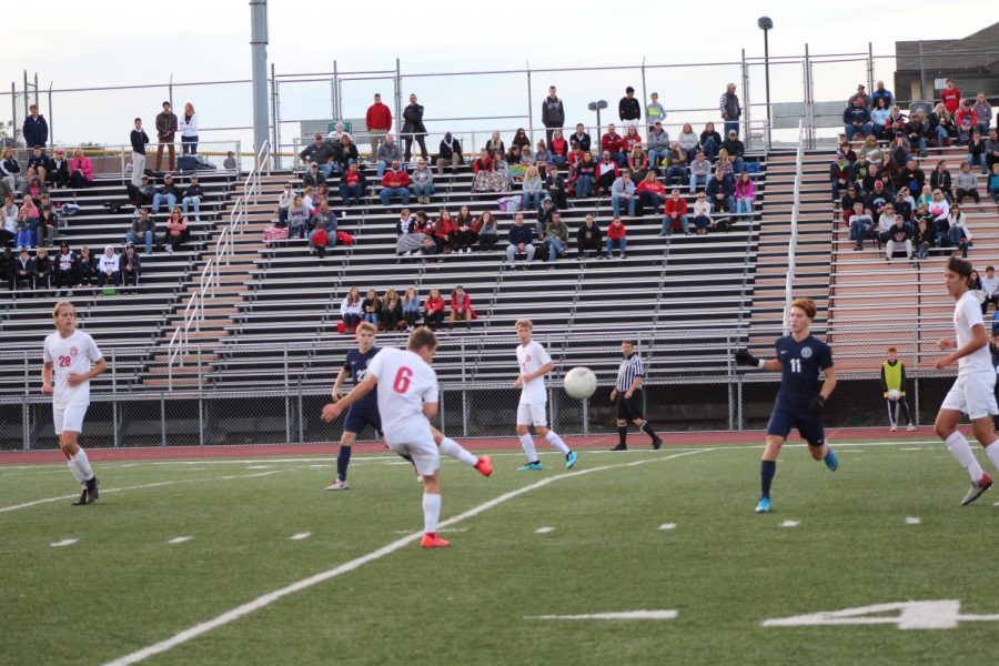 Barrett kicks the ball down the field in order for the Warriors to make an attempt at scoring. 
Photo by Ava Holloway.