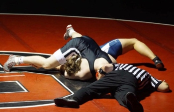 Little Man pins down his opponent during the West York match. Photo via @ohmann_55 on Instagram.