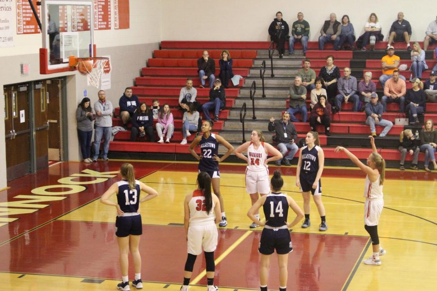 The Warriors watch as Sophomore Tyler Elliott sinks a foul shot. She is 28 for 47 on foul shots for the season.
Photograph by Mateo Vega