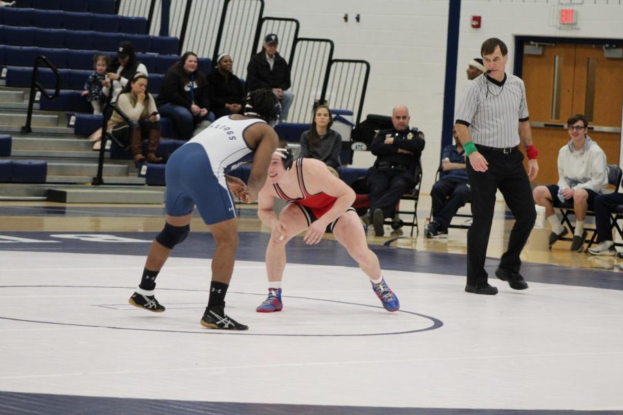 Romjue taunts his opponent and prepares to make the first move in order to pin the player. Photo by Mackenzie Womack.